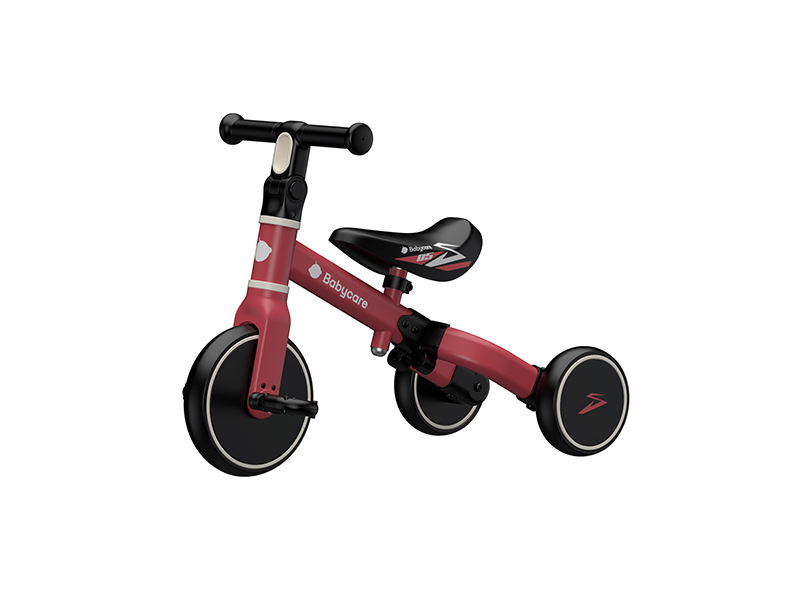 side view of black and brown balance bike