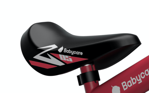 close up view of black and red kids tricycle's seat