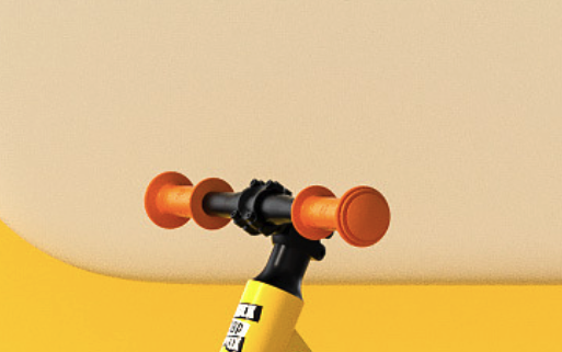 black balance bike handlebars with ergonomic orange grips
