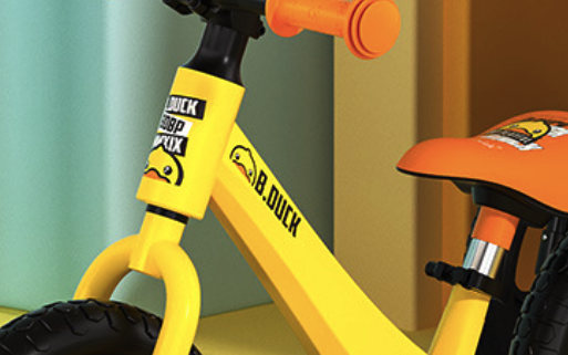 yellow stem part of a balance bike