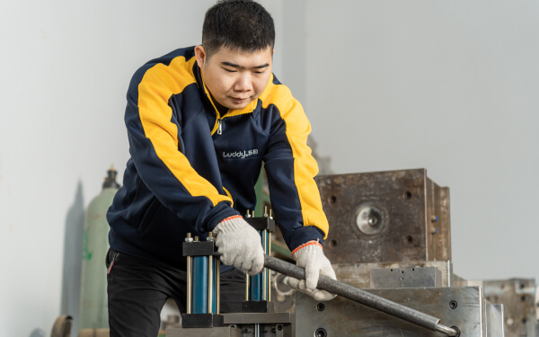 workers setting the production equipment