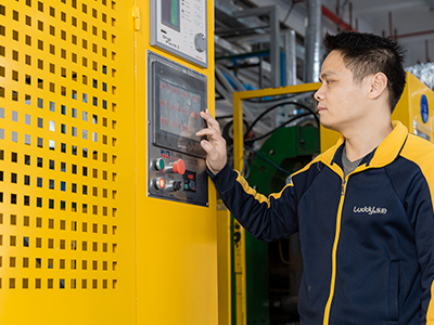 man operating a production equipment's console