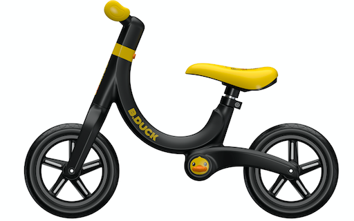 side view of yellow and black balance bike