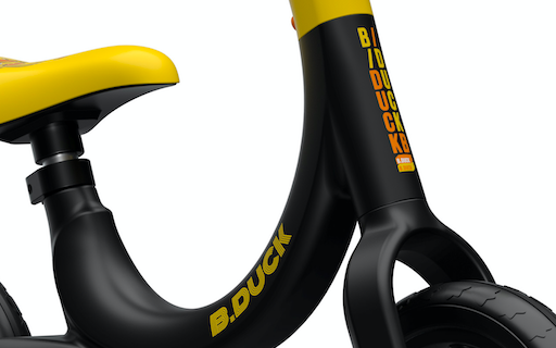close up view of yellow and black balance bike stem