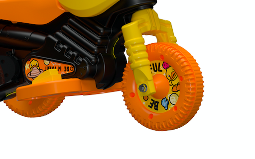 close up view of yellow ride on toy front wheels