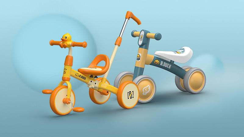 balance bike gialla e arancione con balance bike blu e gialla