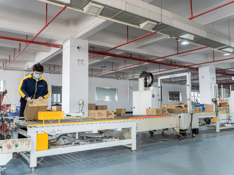 man checking the packaging on the production line